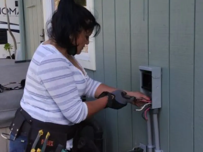 Licensed electrician wiring an exterior subpanel in Gallipolis